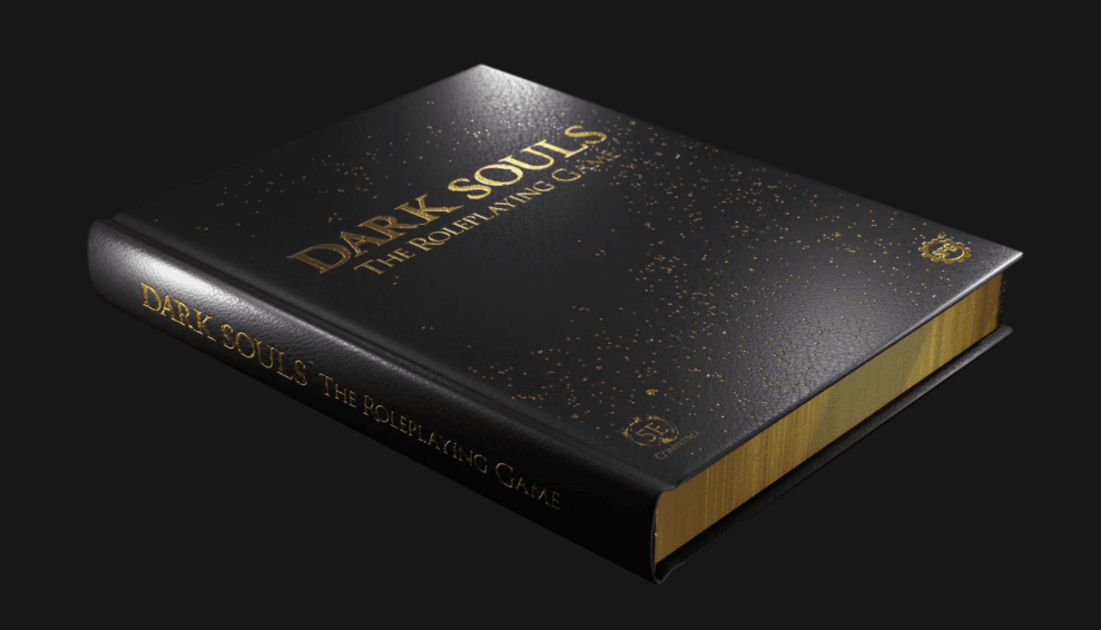 Opis obrazka: zdjęcie przedstawia limitowaną edycję podręcznika do Dark Souls. Czarna, gruba okładka posiada złote akcenty oraz błyszczące boki w złotym kolorze.